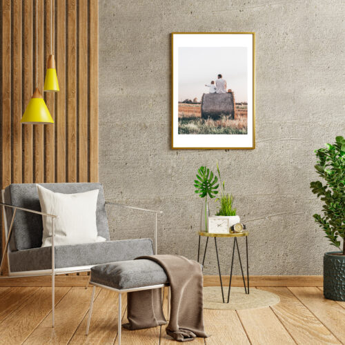 Mockup poster frame in a modern living room with an empty concrete wall.